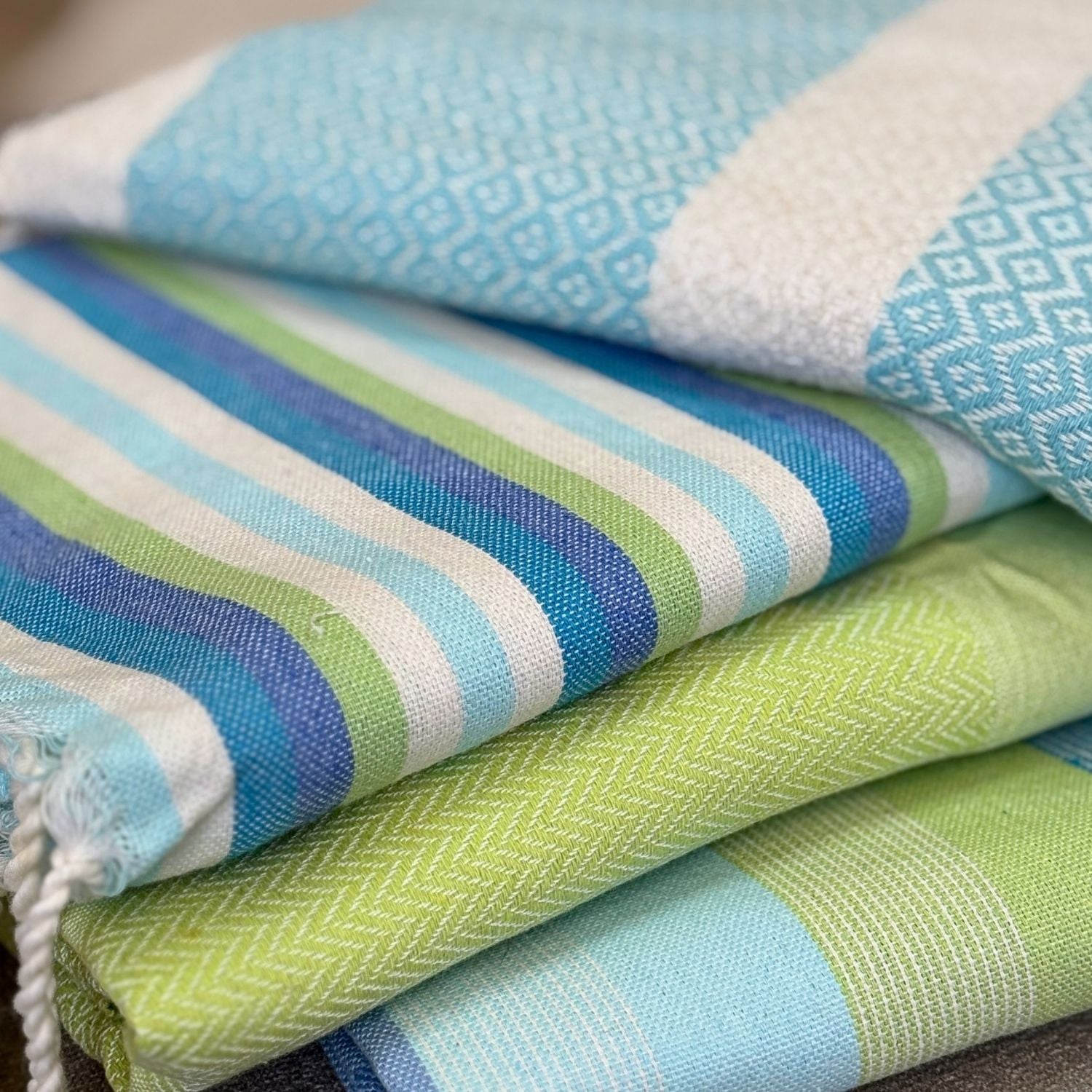 folded lime green fouta towel with tassels showing full size and woven cotton detail