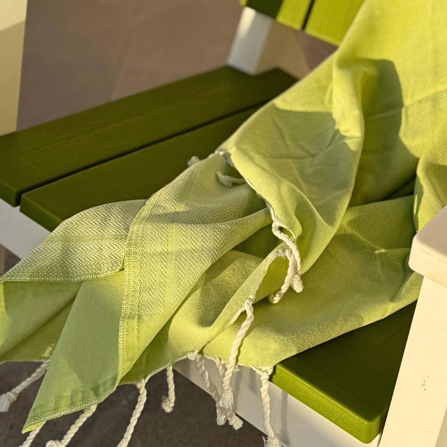 hand finished tassels on lime fouta towel soft twisted fringe detail on lightweight cotton fabric